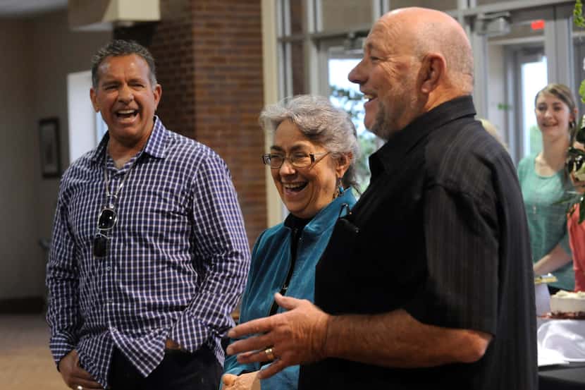 Farris Wilks (right) and his brother Dan Wilks (left) laugh with their sister Beth Maynard...
