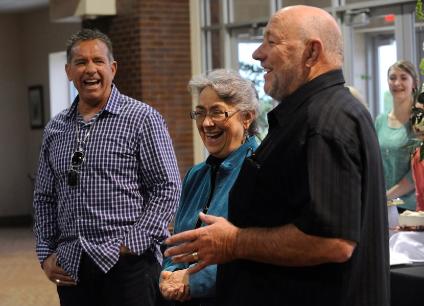 Farris Wilks (right) and his brother Dan Wilks (left) laugh with their sister Beth Maynard...