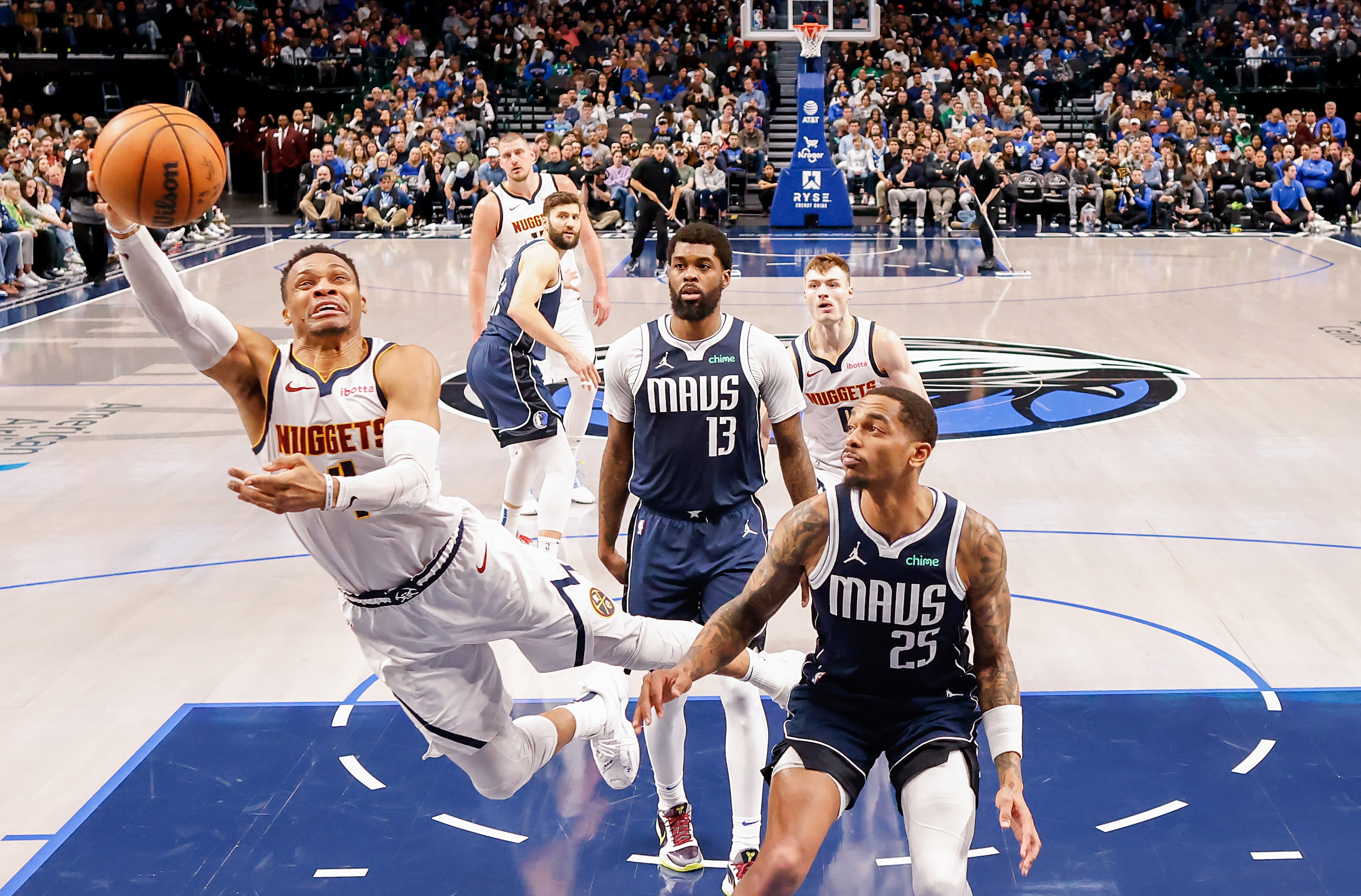 Denver Nuggets guard Russell Westbrook (4) drives to the basket past Dallas Mavericks...