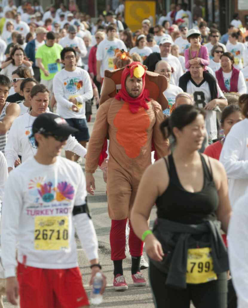 Participants in the YMCA Turkey Trot make their way down Elm St. on Thursday, Nov. 22, 2012.
