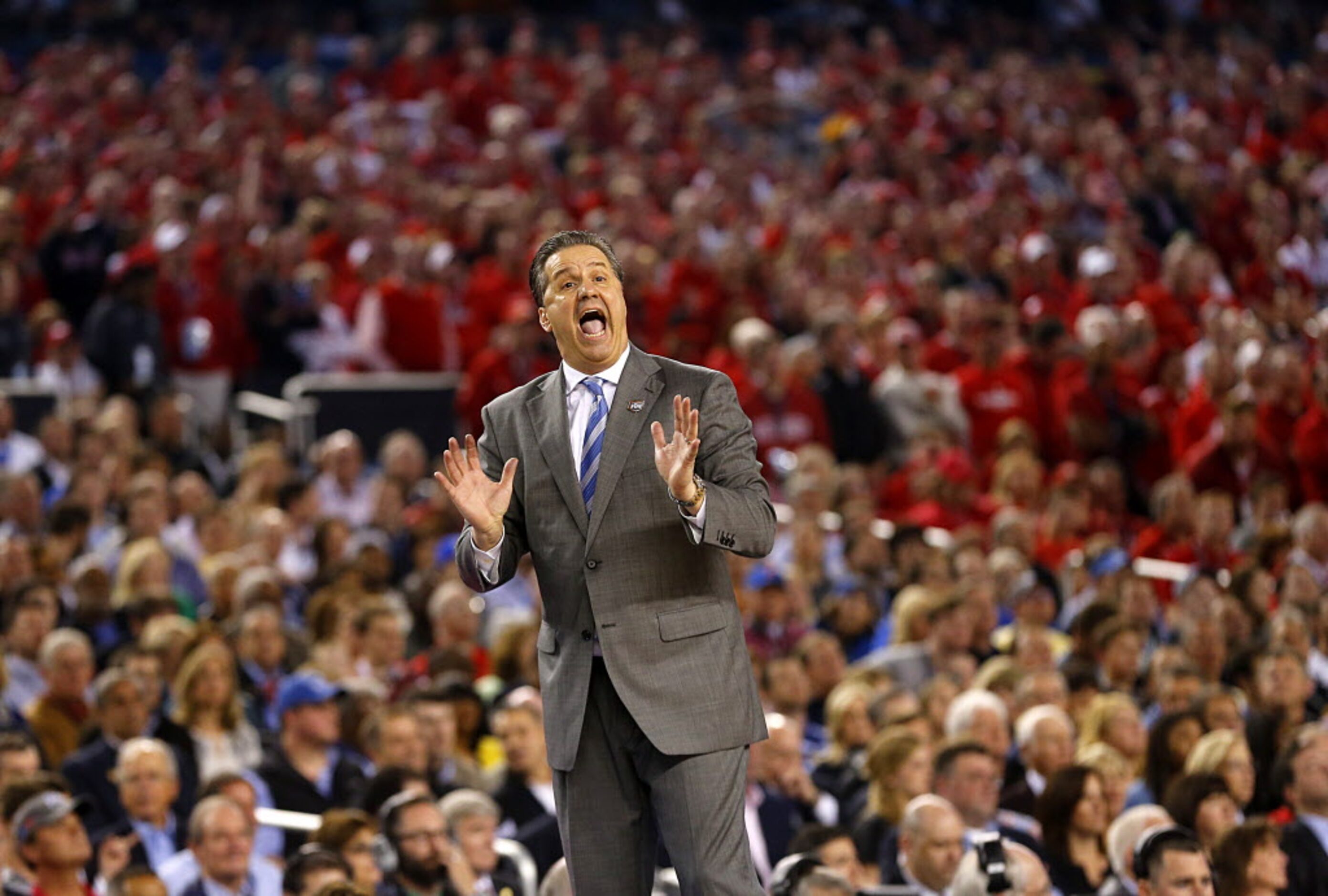 Kentucky Wildcats head coach John Calipari yells to his players as they square off against...