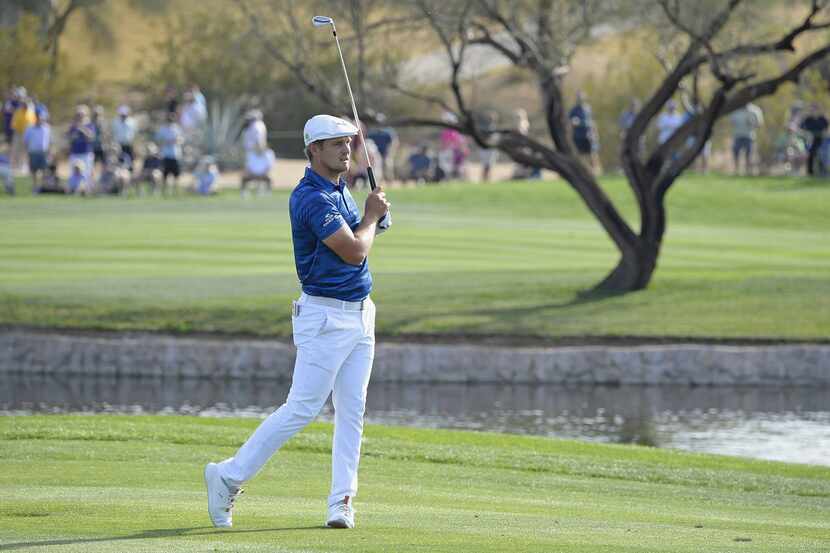 SCOTTSDALE, AZ - FEBRUARY 02:  Bryson DeChambeau watches his tee shot on the during the...