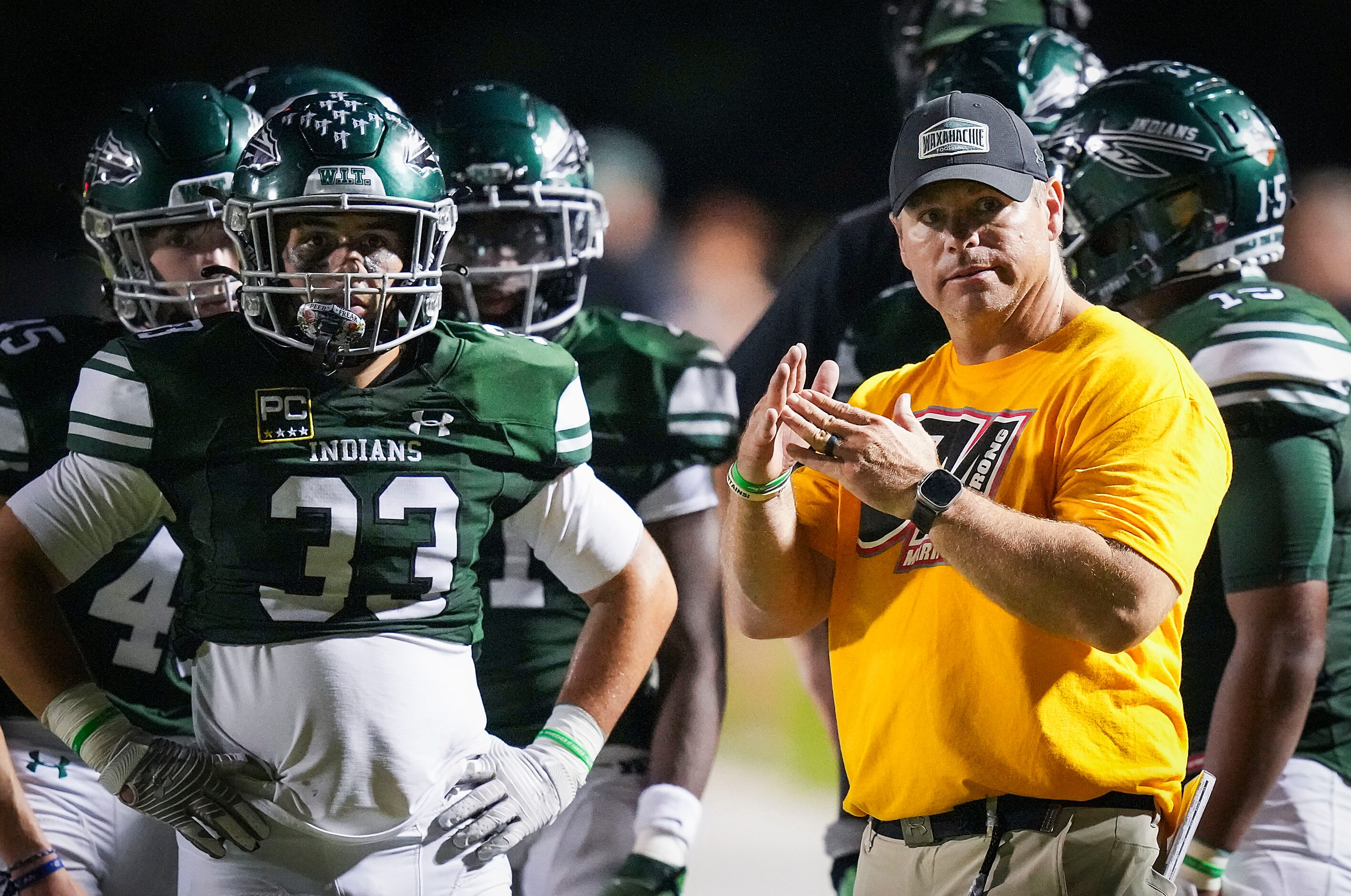 Waxahachie head coach Shane Tolleson motions for a time out during the second half of a...