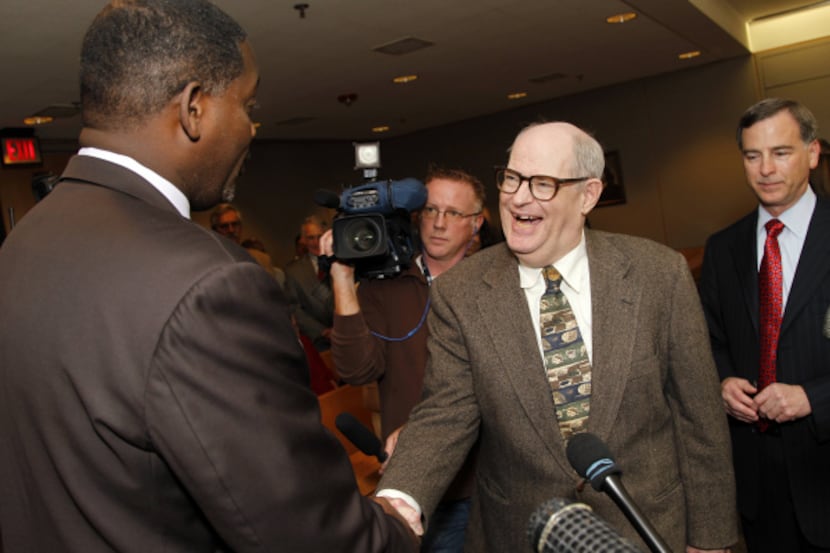 Dale Lincoln Duke, 60, shakes hands with Dallas District Attorney Craig Watkins after Duke...