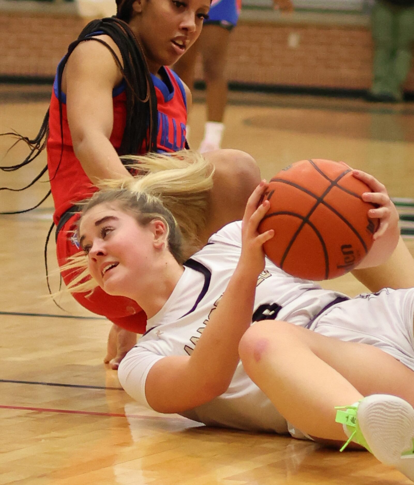 Mansfield guard Abby Bush (30) looks to pass to a teammate after winning the battle for a...