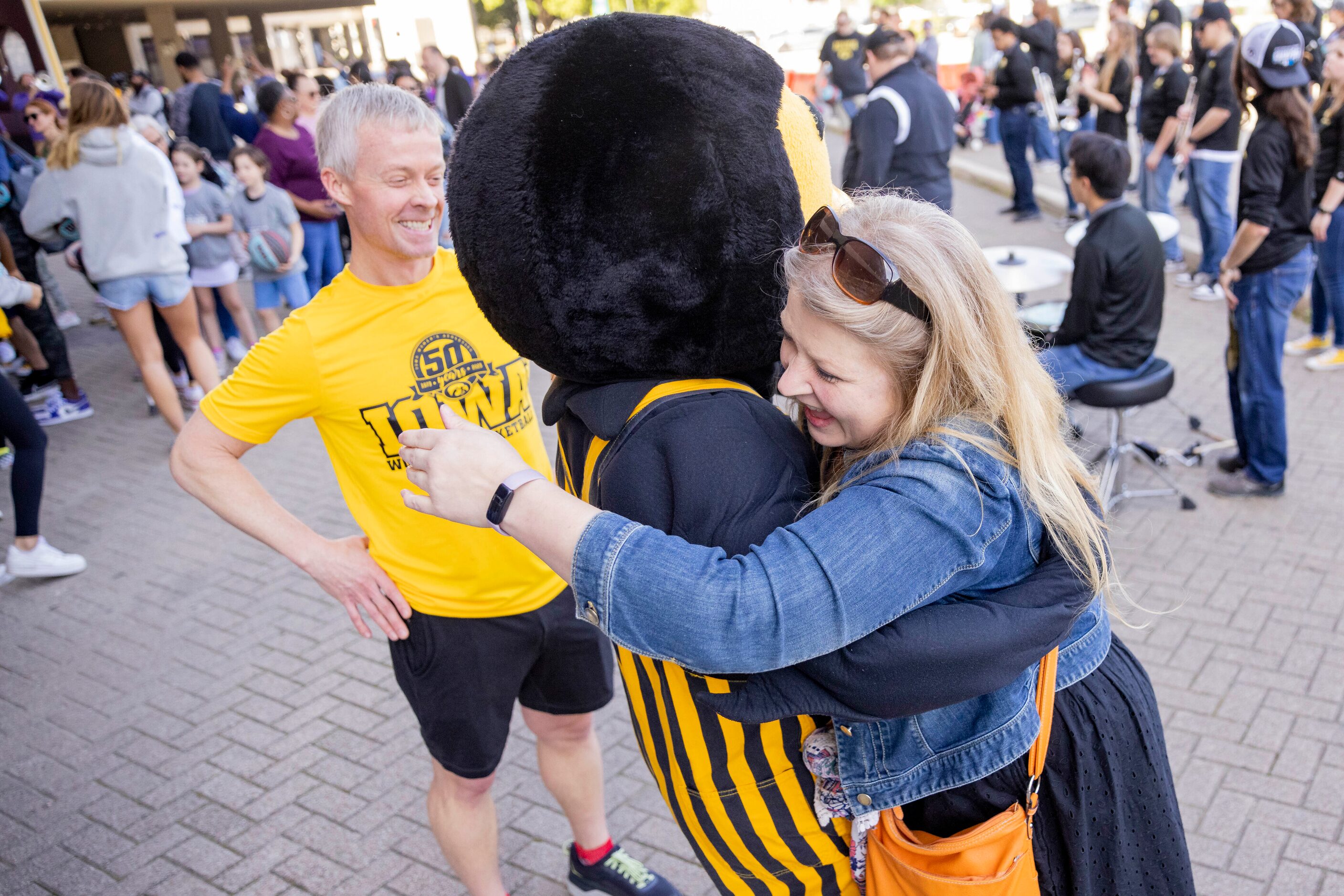 Jeff and Sandy Kreinbring of Iowa City, IA greet Iowa’s mascot “Herky the Hawk” at the Kay...