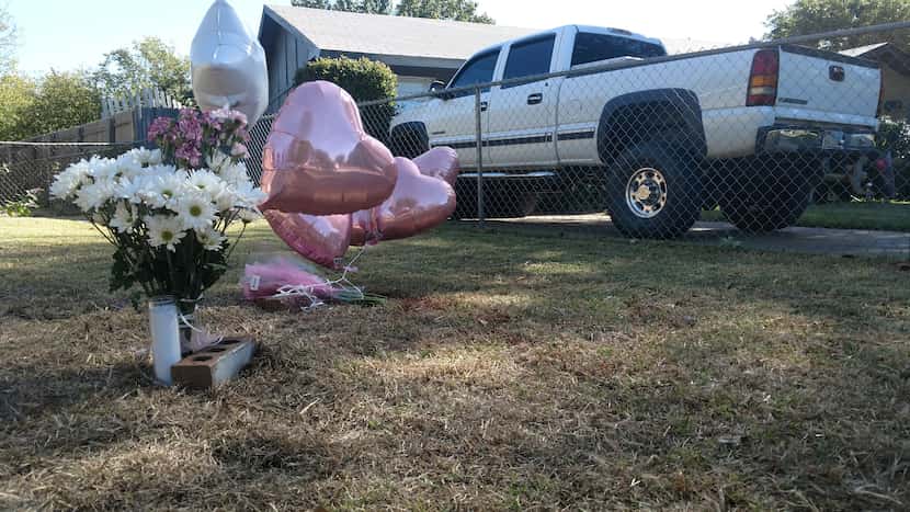 A makeshift memorial sprang up next to the Cedar Hill home where the shooting took place...