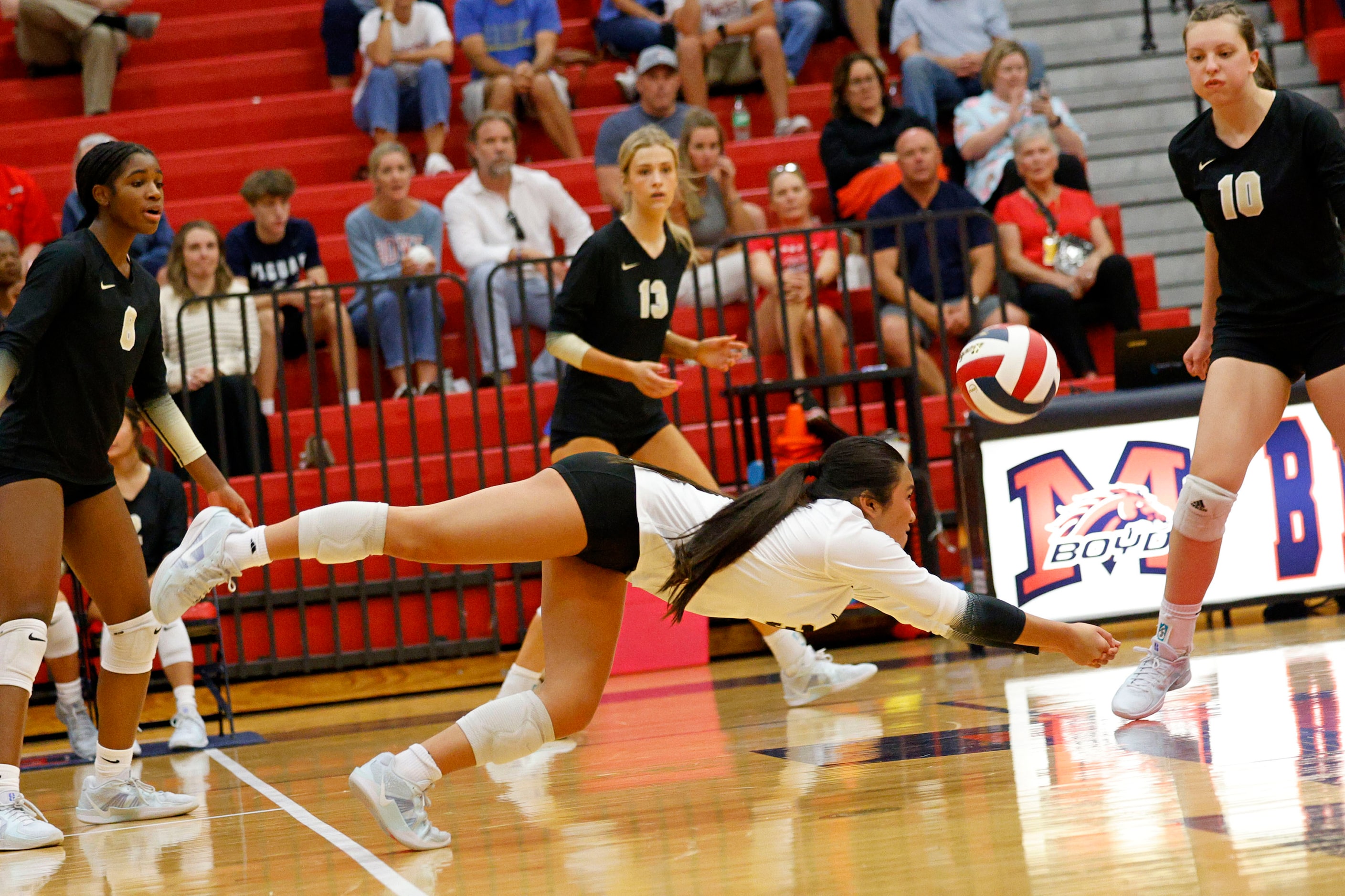 Plano East's Dakota Huynh (3) digs the ball against McKinney Boyd as her teammates Simone...