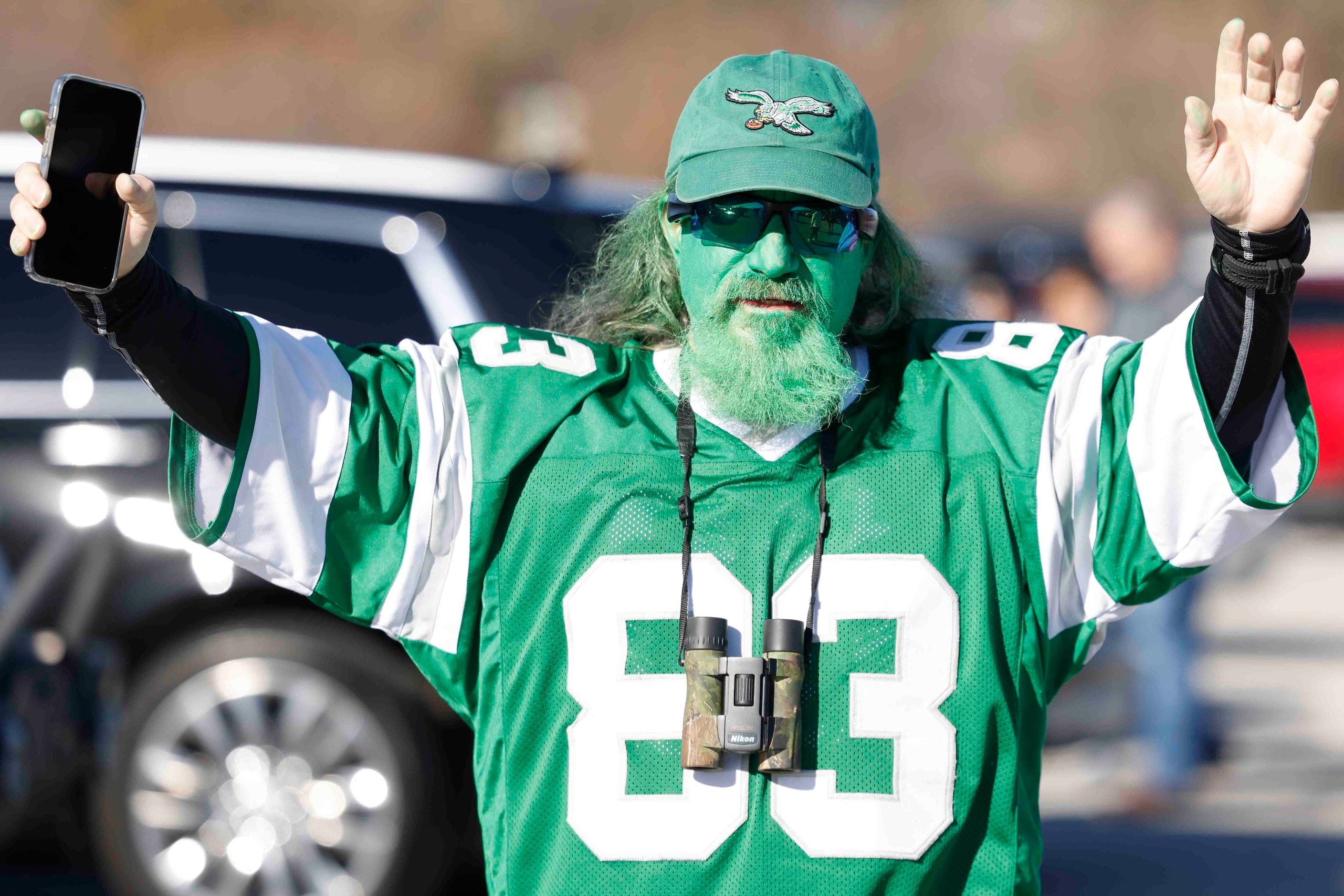 Philadelphia Eagles fan Robert Gastwirth dressed as Grinch cheer as he make his way towards...