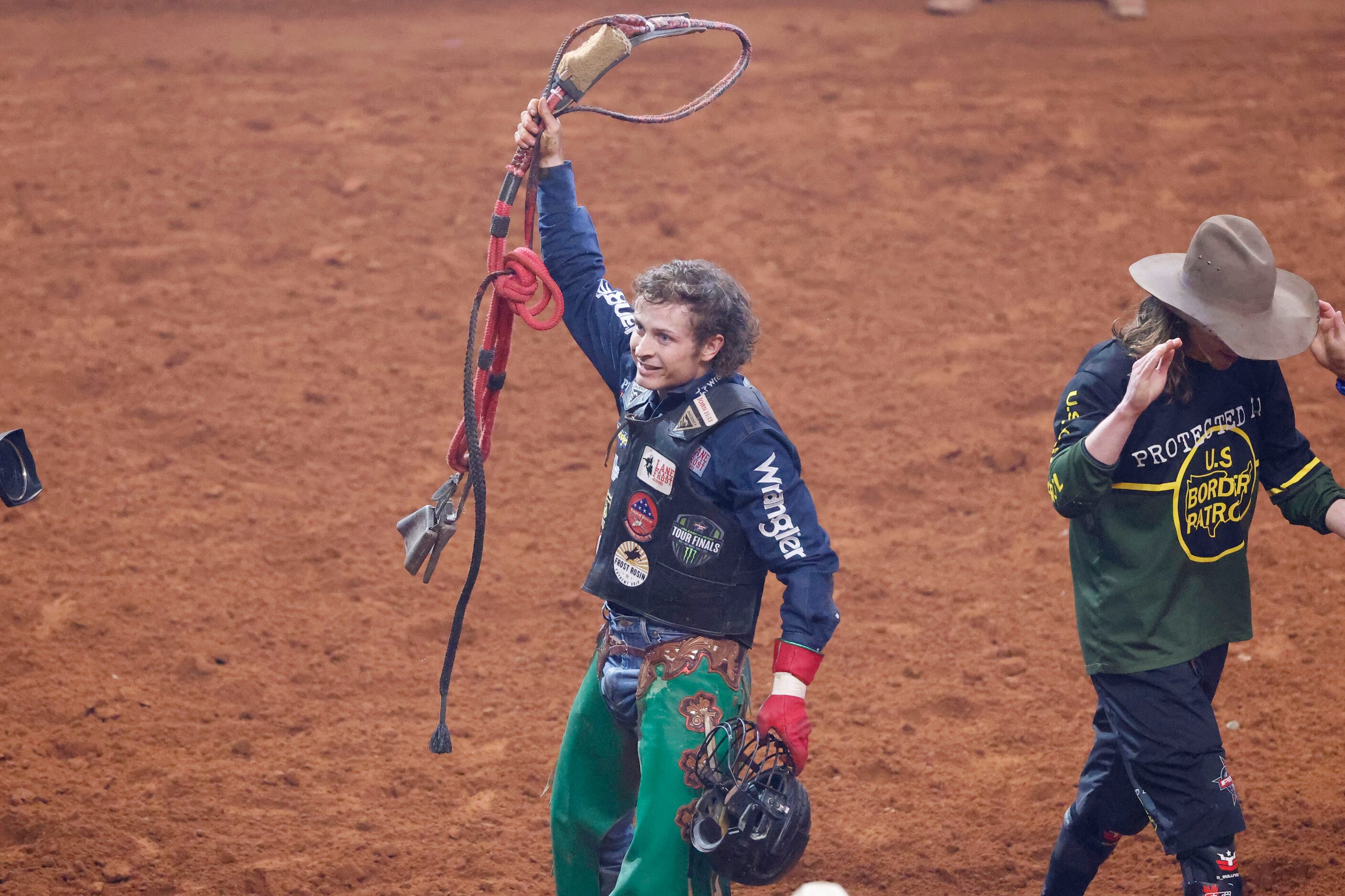 Josh Frost celebrates after he scored a 92.75 after riding “Riding Solo” during the PBR...