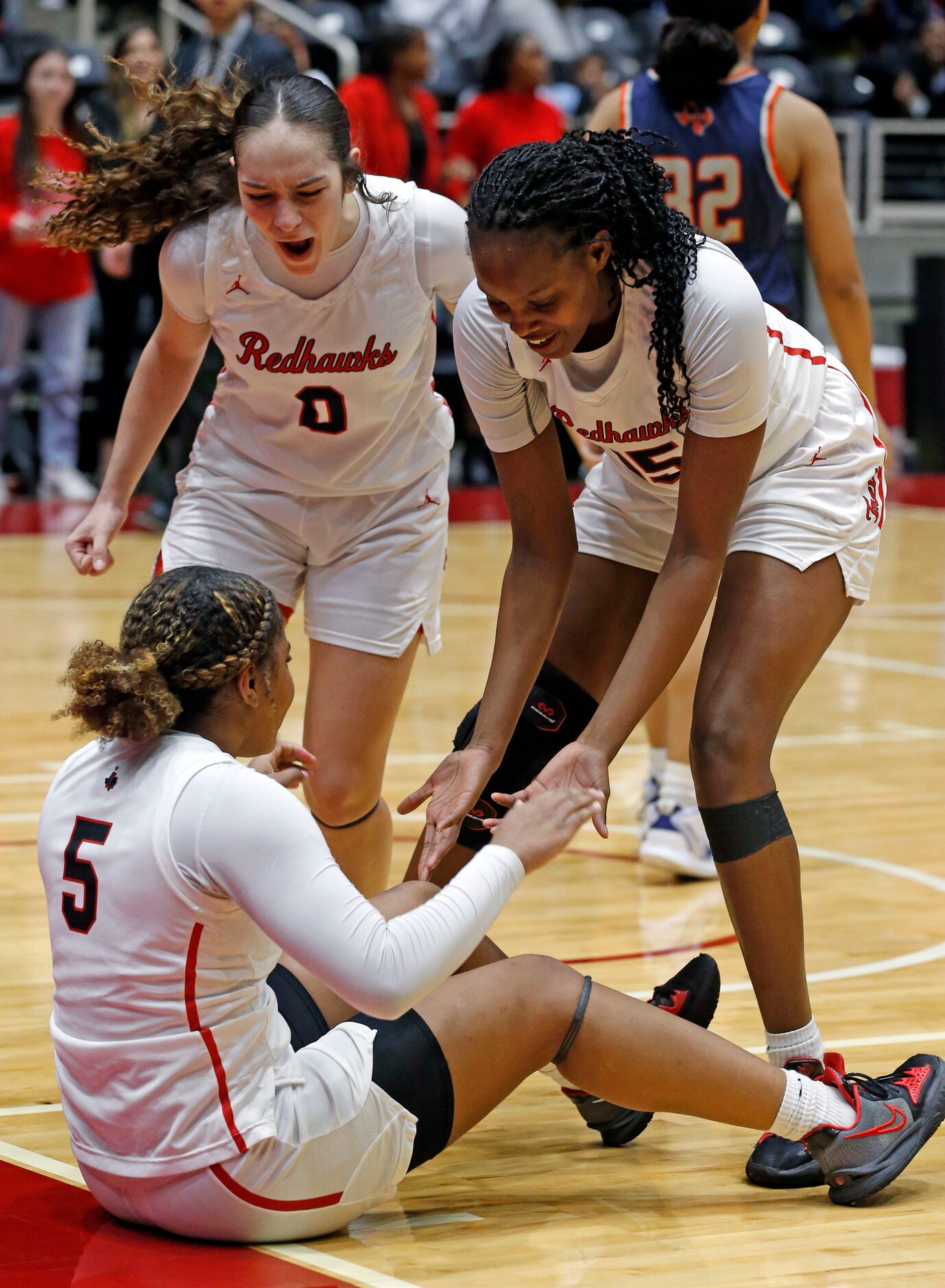 Frisco Liberty High’s G Jezelle Jolie Moreno (0) and C Za’naiha Hensley (15) celebrate with...