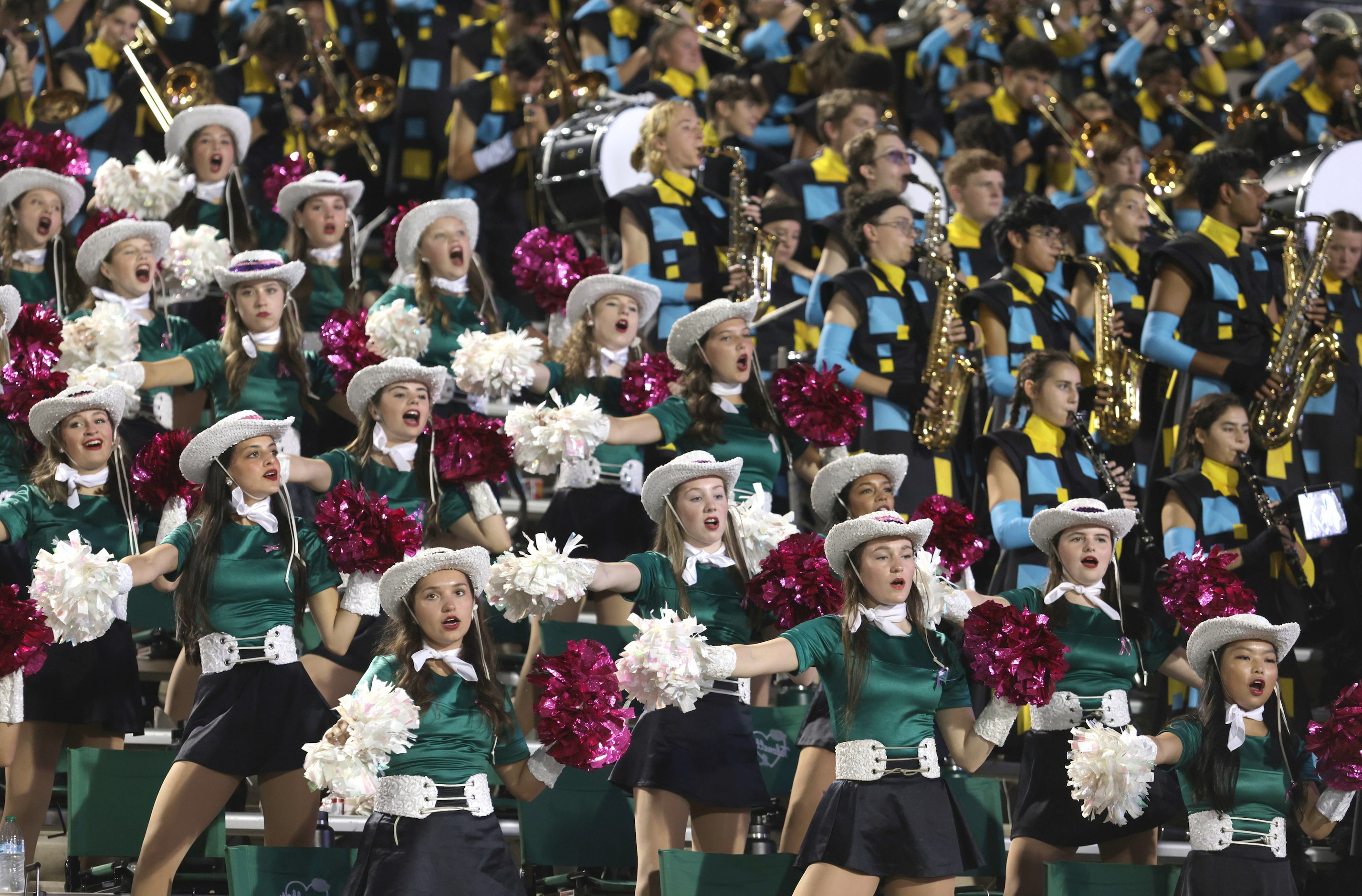 The Prosper team cheers during the Prosper High School at Allen High School football game at...