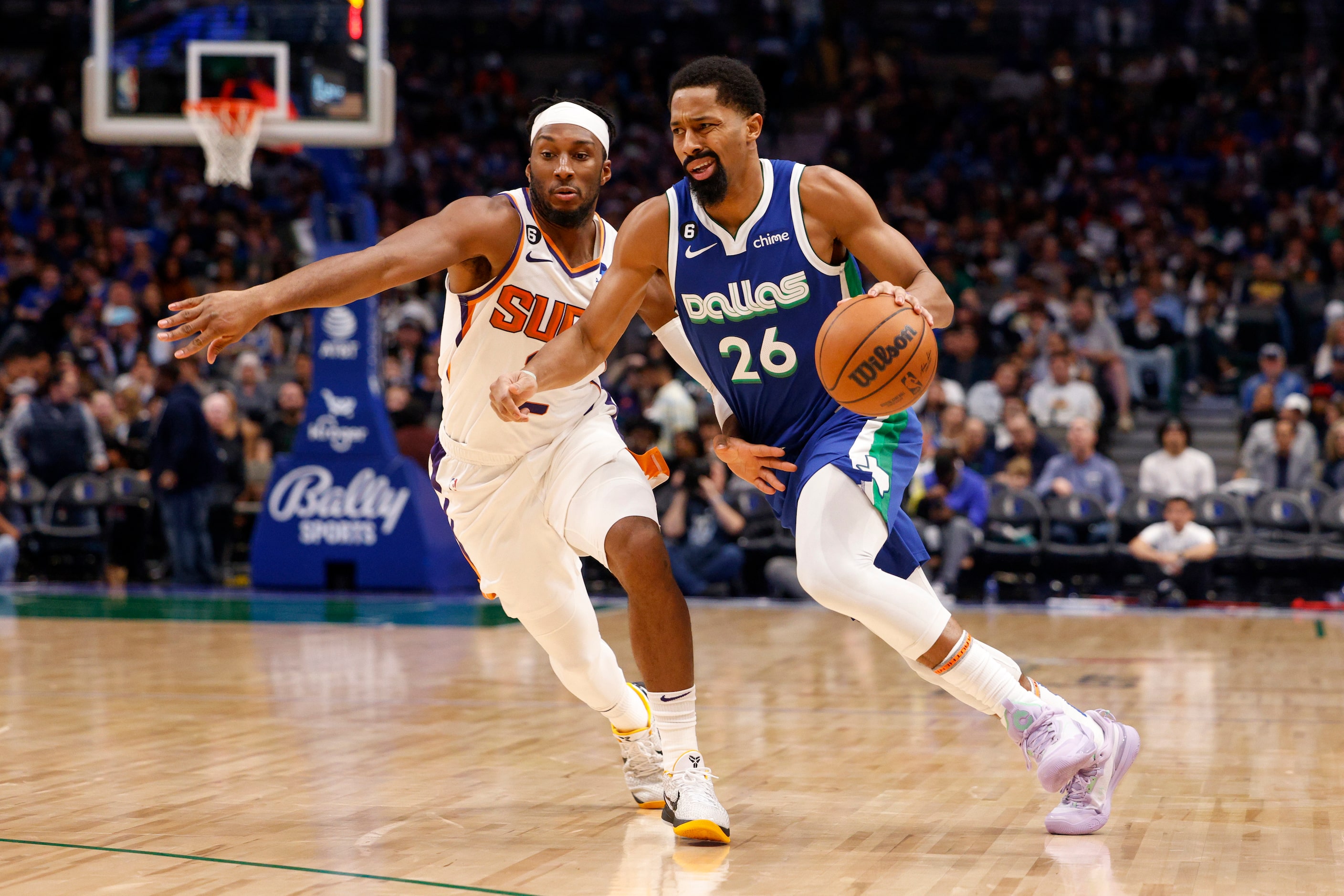 Dallas Mavericks guard Spencer Dinwiddie (26) drives past Phoenix Suns forward Josh Okogie...