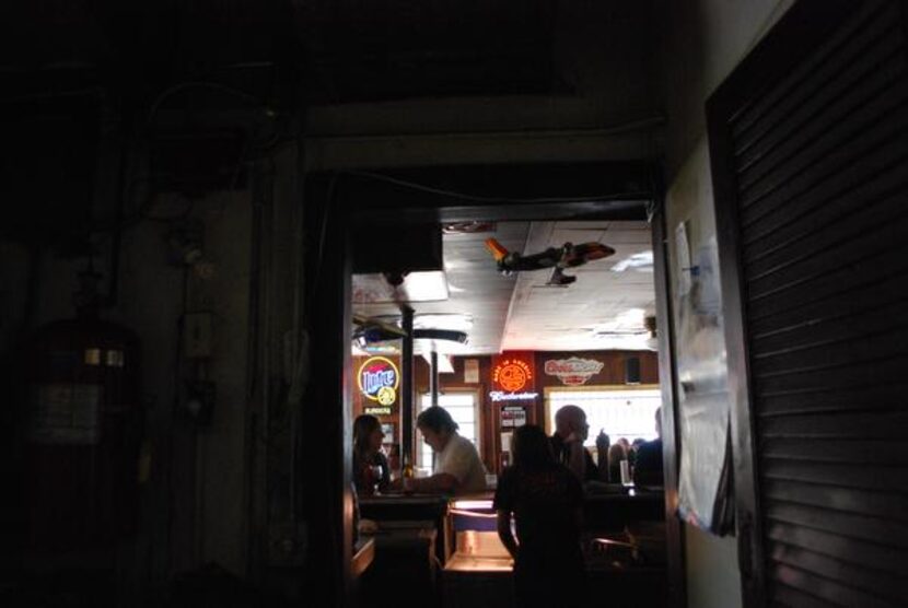 
Lunchtime customers sit at the bar at Club Schmitz, which is closing May 31 after 68 years.
