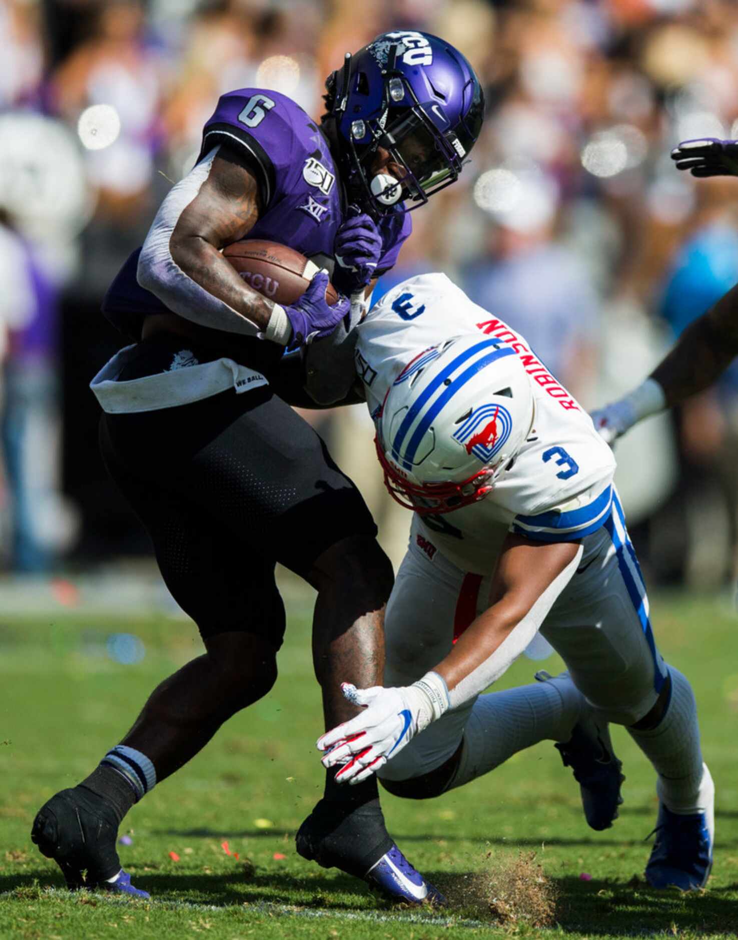 TCU Horned Frogs running back Darius Anderson (6) avoids a tackle by Southern Methodist...