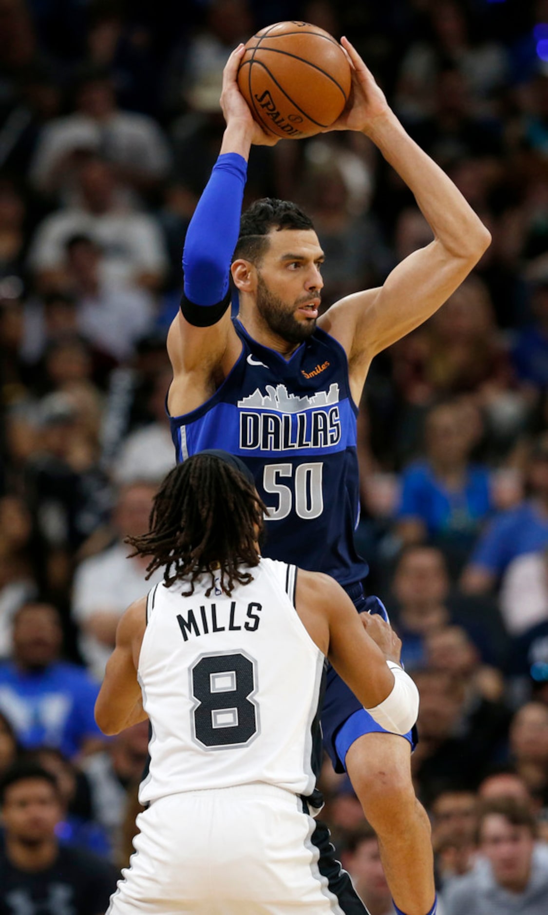 Dallas Mavericks center Salah Mejri (50) looks to pass over San Antonio Spurs guard Patty...