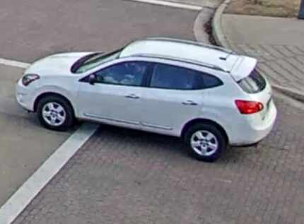A surveillance image shows the Nissan Rogue driving away.