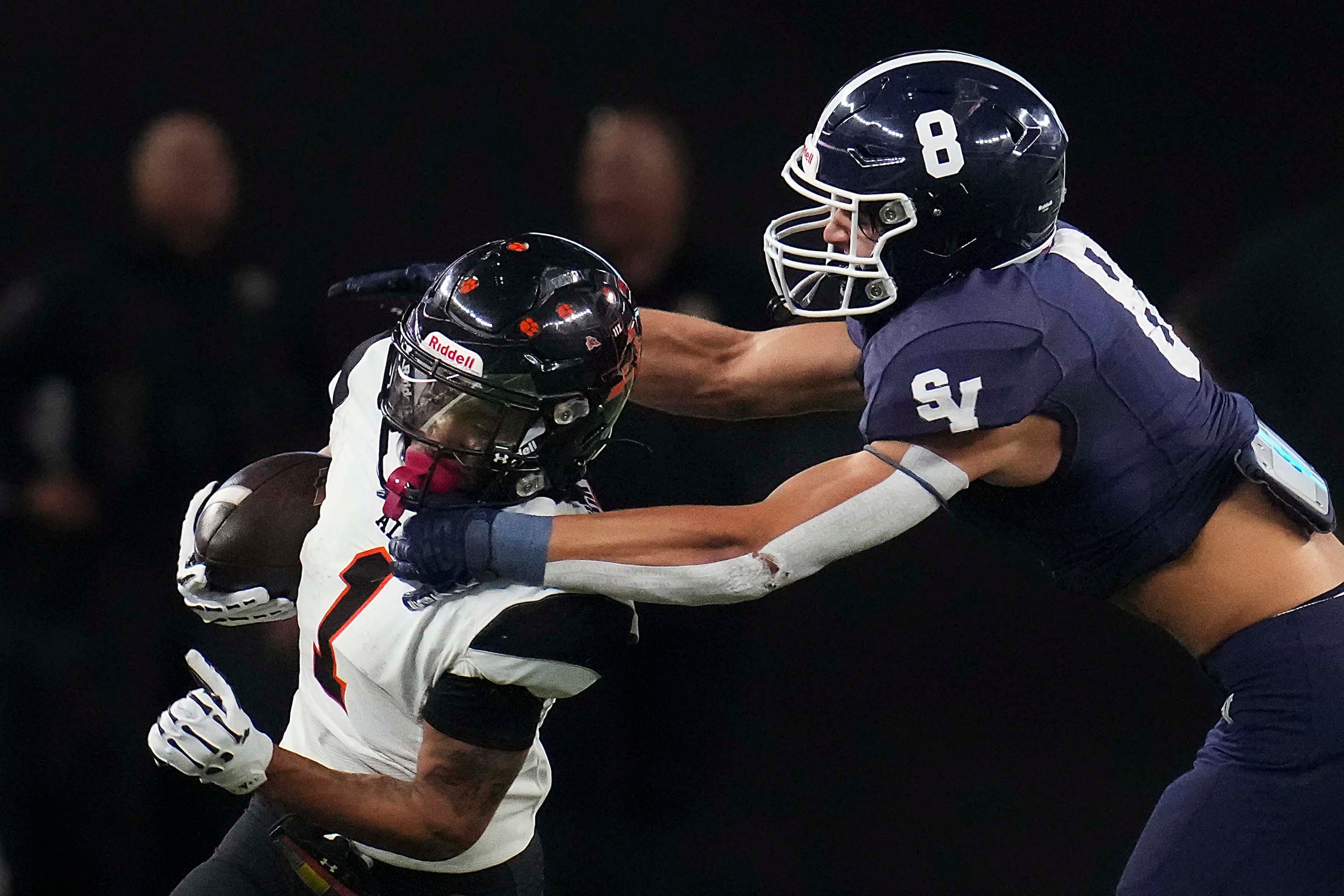 Aledo's Hawk Patrick-Daniels (1) tries to get past Comal Smithson Valley defensive back Zach...