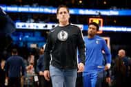 Dallas Mavericks former owner Mark Cuban leaves the floor following their loss to the New...