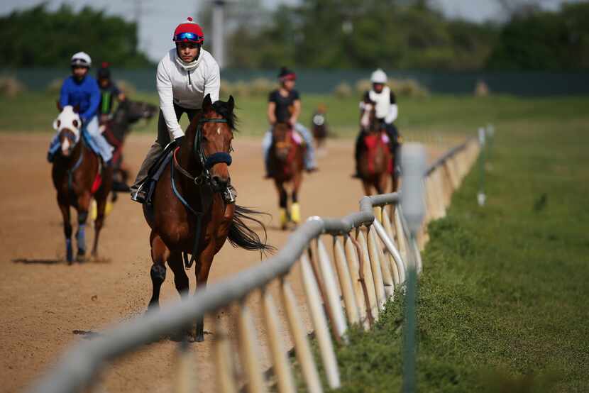 Horse and riders in the track at Lone Star Park in Grand Prairie, Texas Tuesday April 17,...