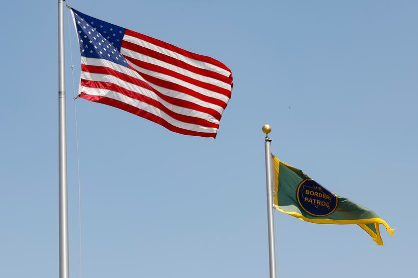 Flags flying over the U.S. Customs and Border Protection’s Ursula Processing Center, on...