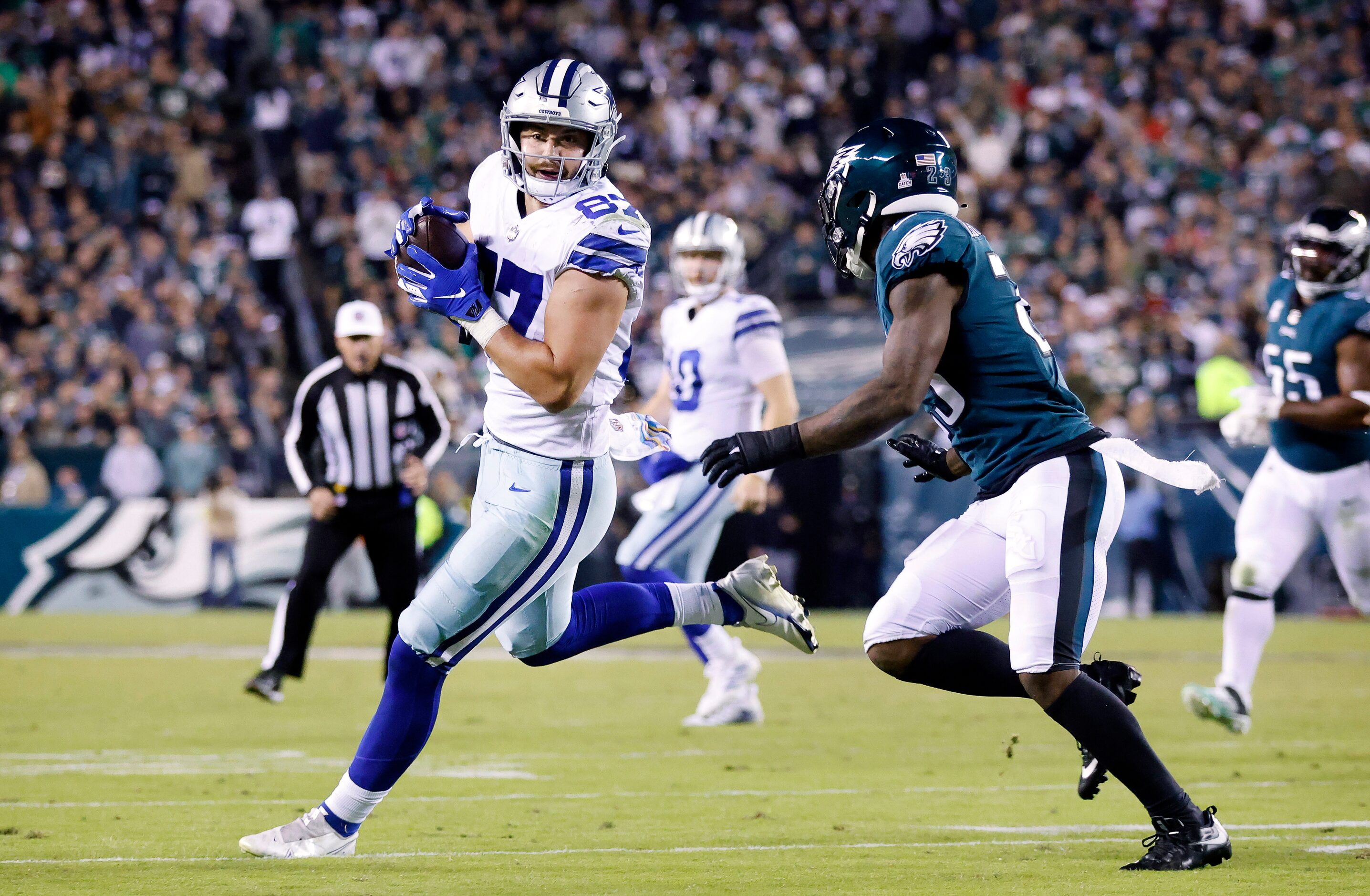 Dallas Cowboys tight end Jake Ferguson (87) makes a pass completion in front of Philadelphia...