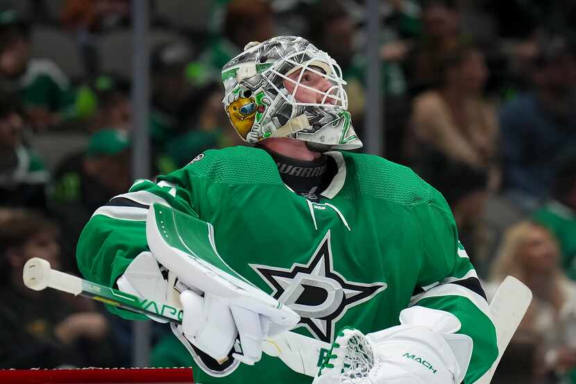 Dallas Stars goaltender Jake Oettinger looks up at the scoreboard during the second period...