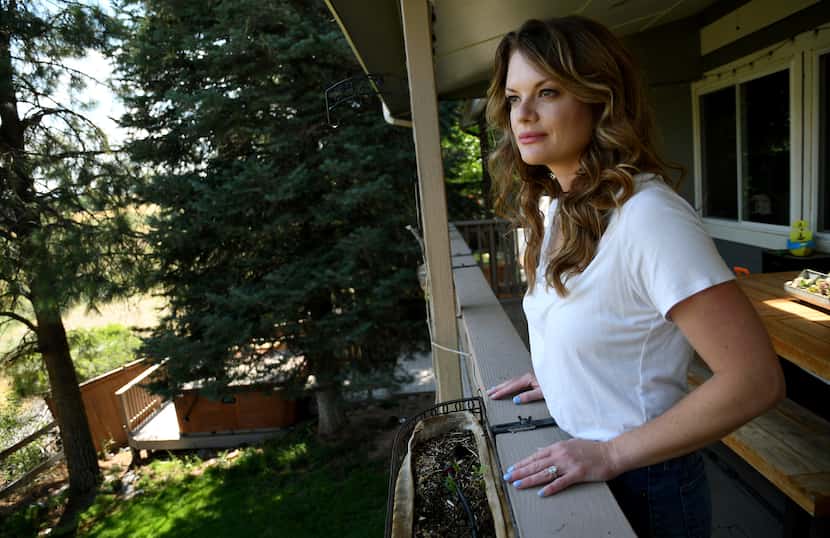 Sonia Moran looks at a meadow owned by The Rock church from her patio in Castle Rock, Colo.,...