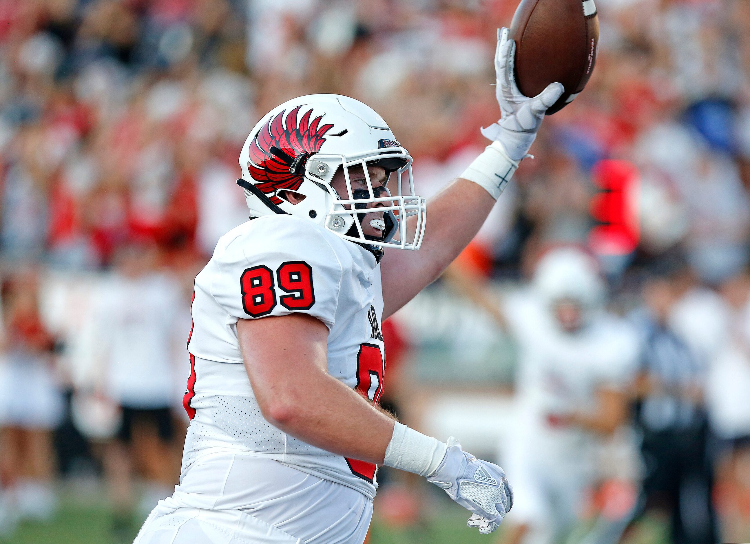 Argyle High School tight end Grant Chaney (89) holds up the ball after scoring a on a...