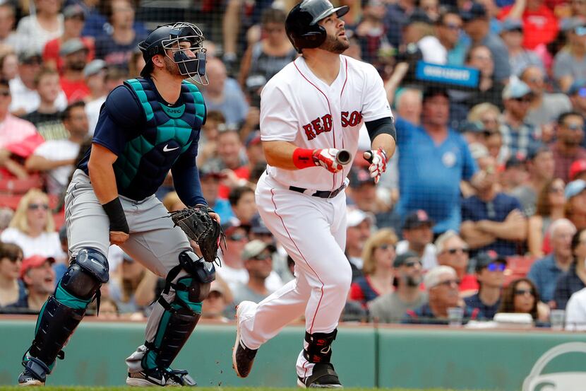 Boston Red Sox's Mitch Moreland watches his two-run home run with Seattle Mariners catcher...