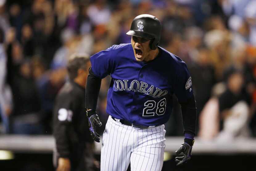 Nolan Arenado reacts after hitting a three-run homer for Colorado in its 10-6 win over the...