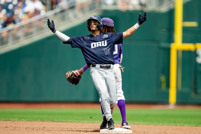 Oral Roberts' Justin Quinn (13) celebrates after a double against TCU in the sixth inning of...