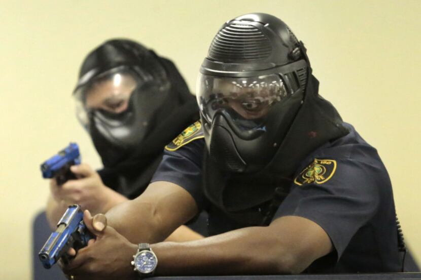 Dallas ISD officers Luis Armendariz (left) and Lawrence Strange took part in active shooter...