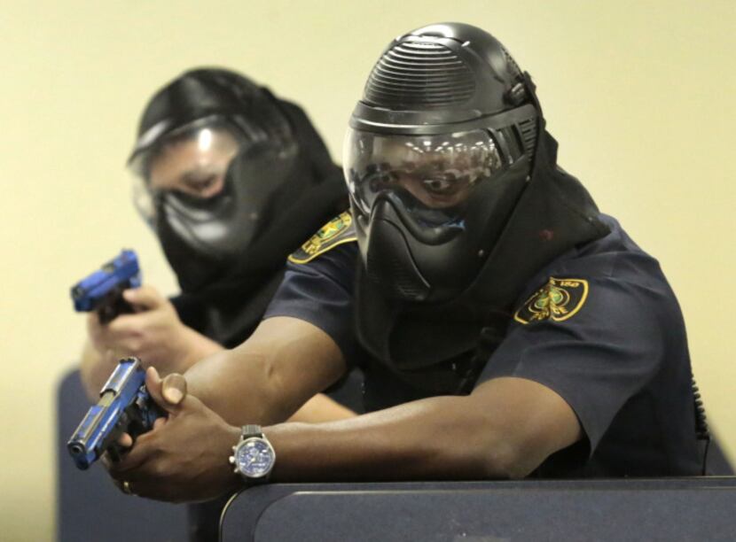 Dallas ISD officers Luis Armendariz (left) and Lawrence Strange took part in active shooter...
