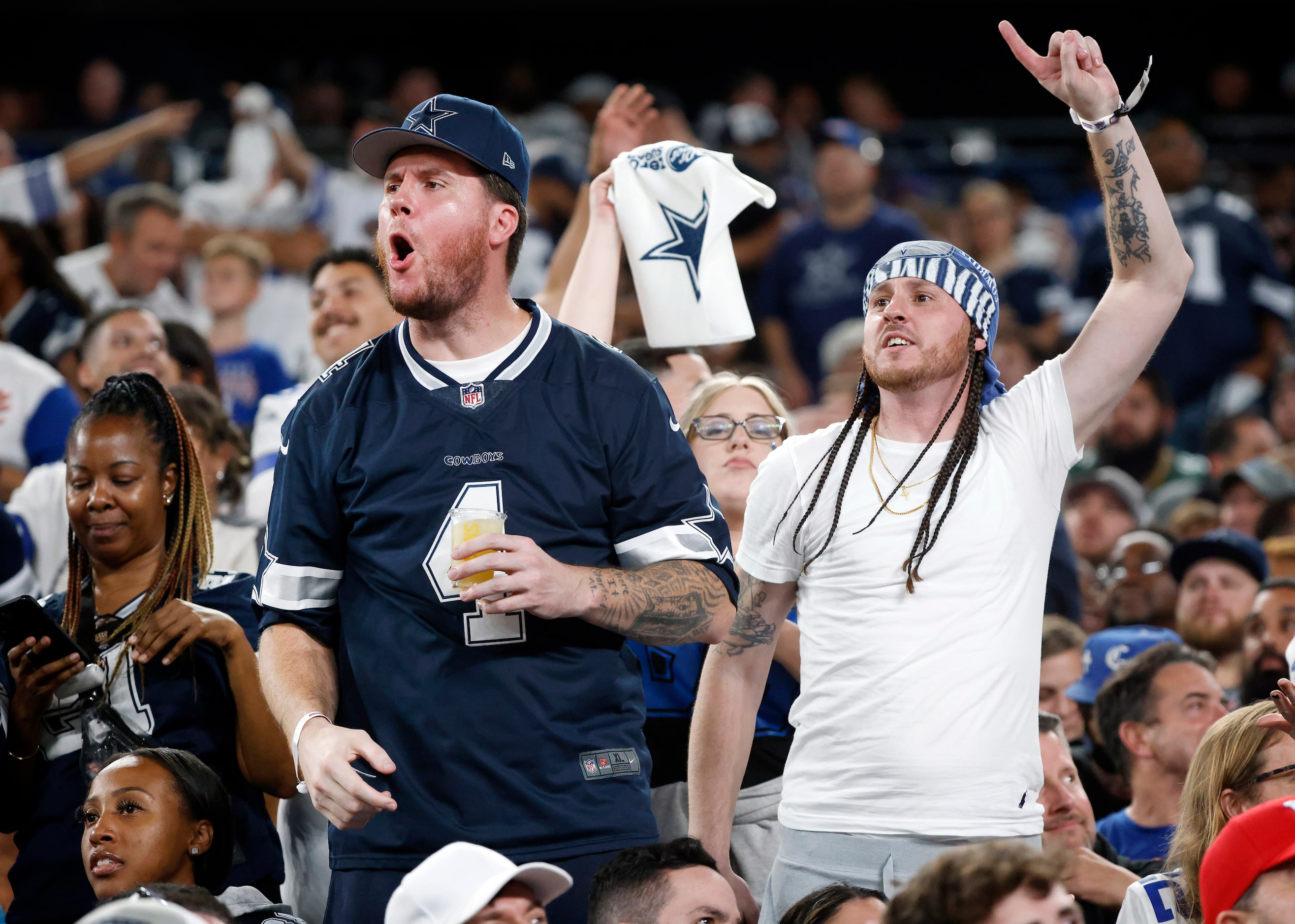 Dallas Cowboys fans react to a call by the officials during the first half against the New...