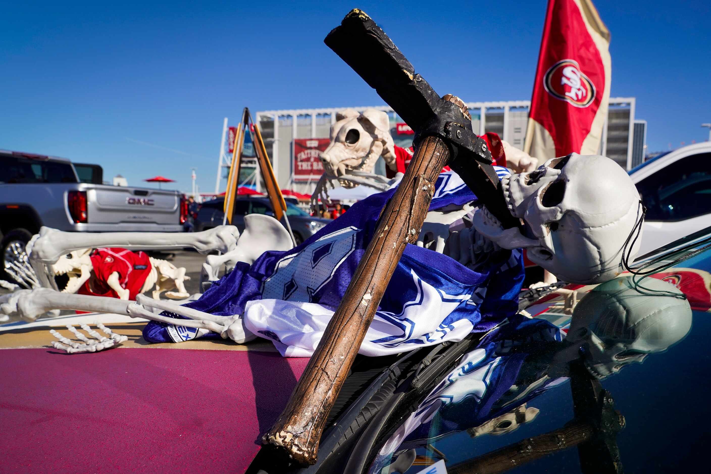 A fan’s tailgating setup depicts a Dallas Cowboys skeleton felled by the San Francisco 49ers...