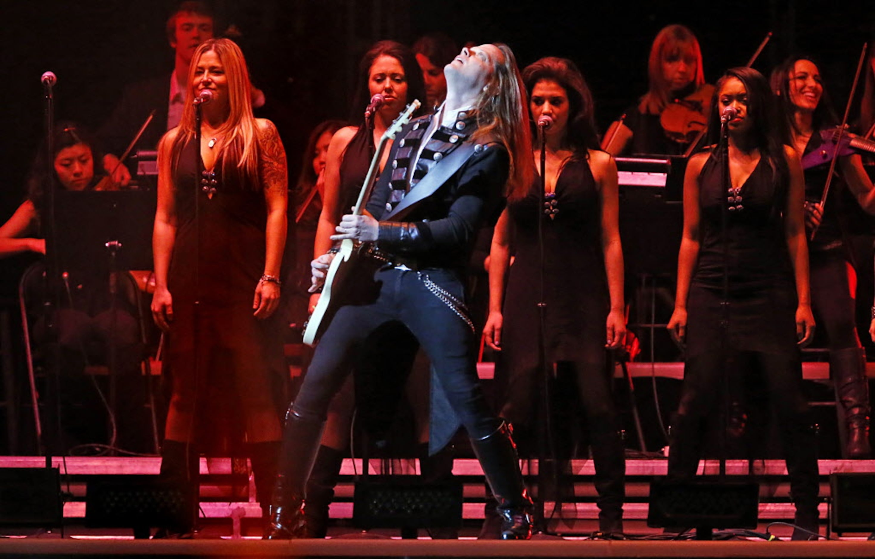 The Trans Siberian Orchestra guitarist Angus Clark performs at the American Airlines Center...