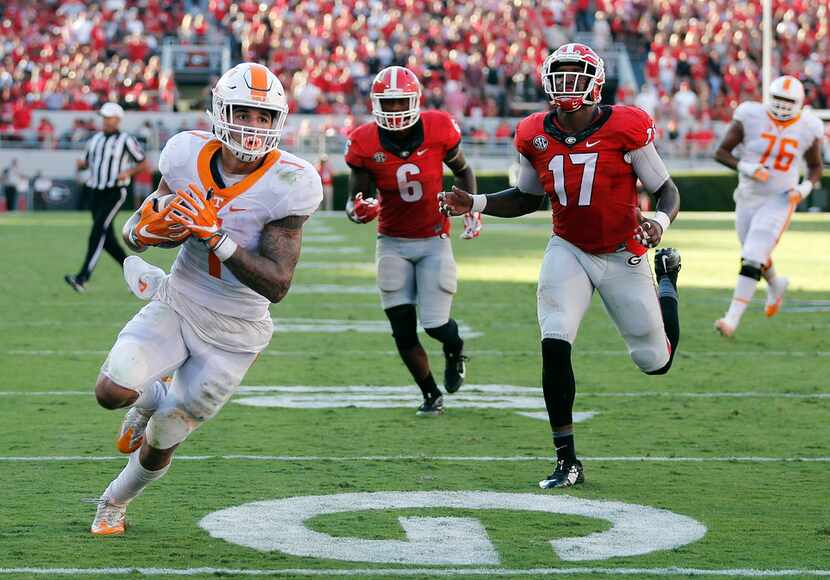 Tennessee running back Jalen Hurd (1) out runs Georgia linebackers Natrez Patrick (6) and...