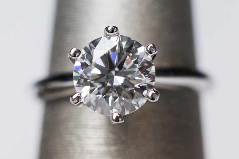 An artisan 2.3 carat, I color, VS2 diamond solitaire ring, priced at $10,739 at Spence...