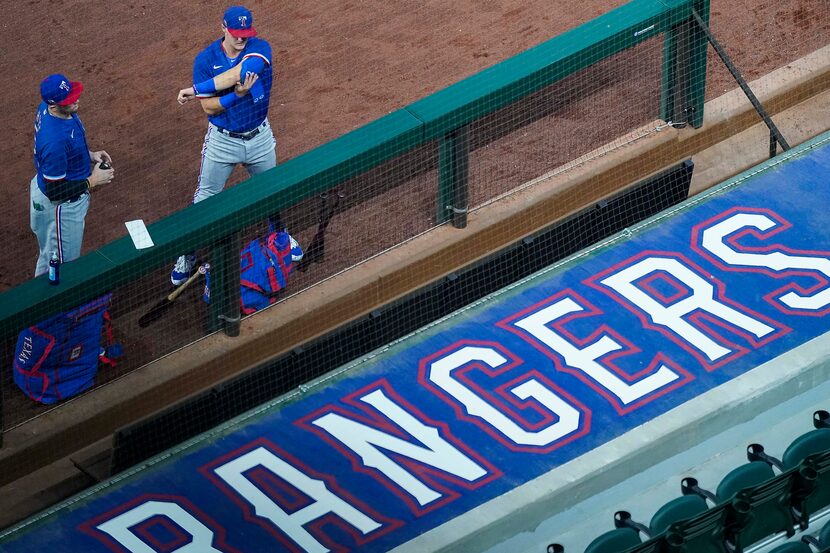 FILE - Catcher Sam Huff (left) and infielder Josh Jung put on their gear before an...