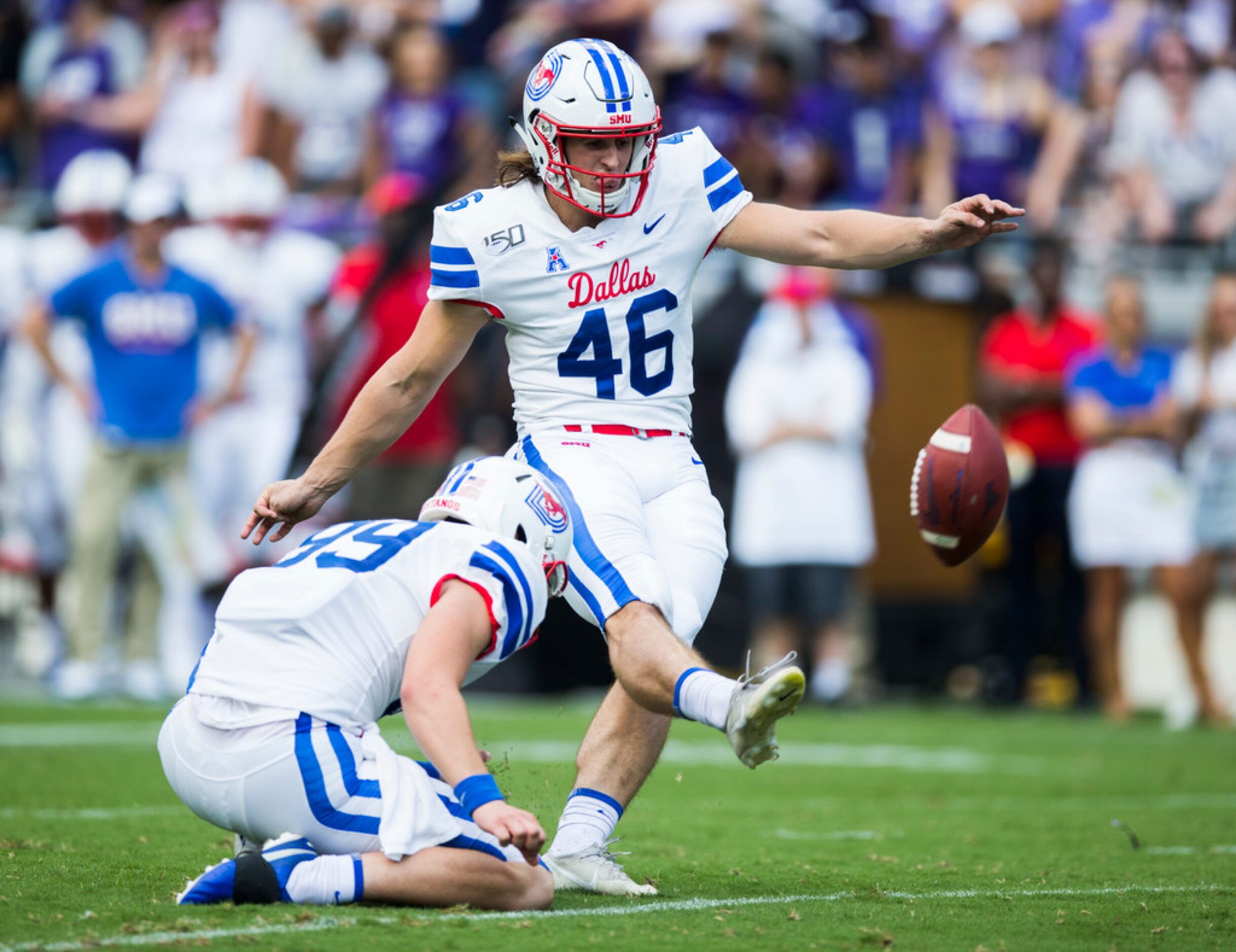 Southern Methodist Mustangs place kicker Luke Hogan (46) kicks an extra point during the...