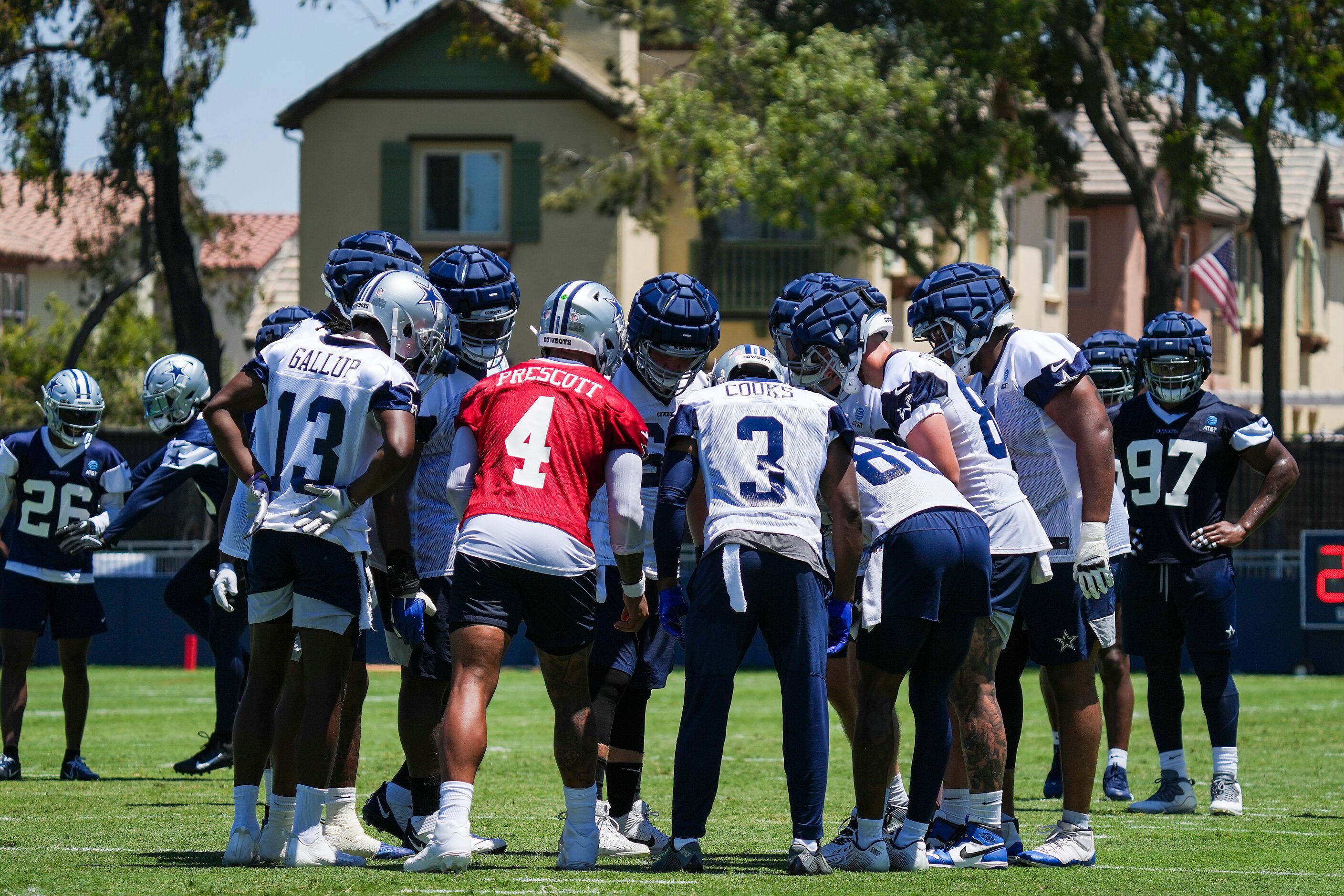 Dallas Cowboys quarterback Dak Prescott (4) huddles the offense, including wide receivers...