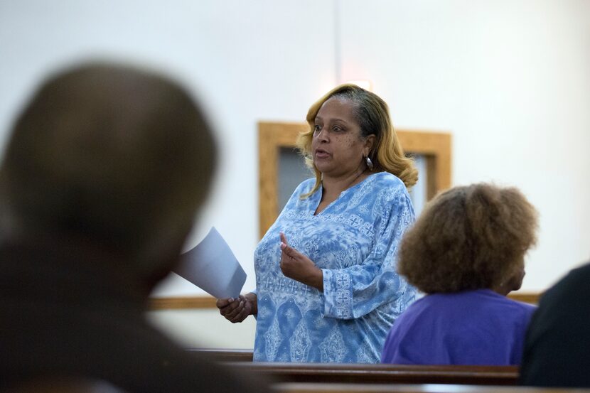 Jacci Robinson speaks after the Dallas Police Department hosted a community meeting at Cedar...