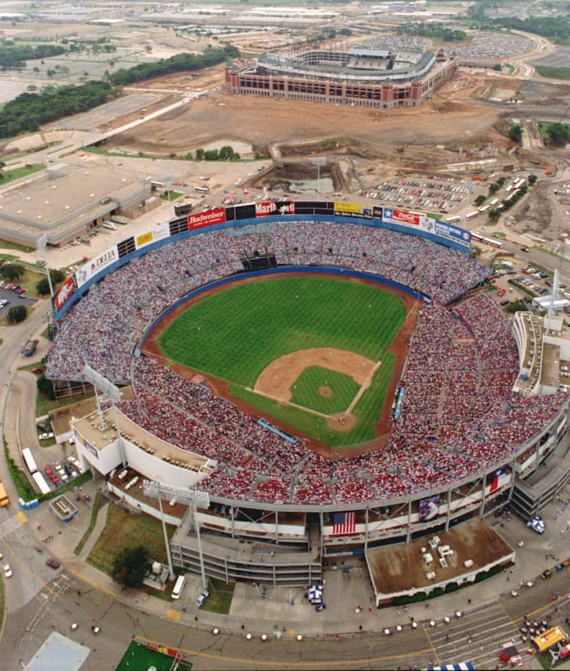 A sellout crowd watches the final game in Arlington Stadium. Globe Life Park, then known as...