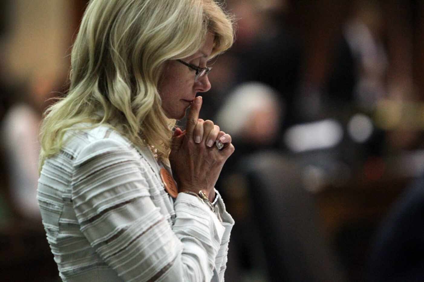 State Sen. Wendy Davis spent a quiet moment after her filibuster was halted on the final day...