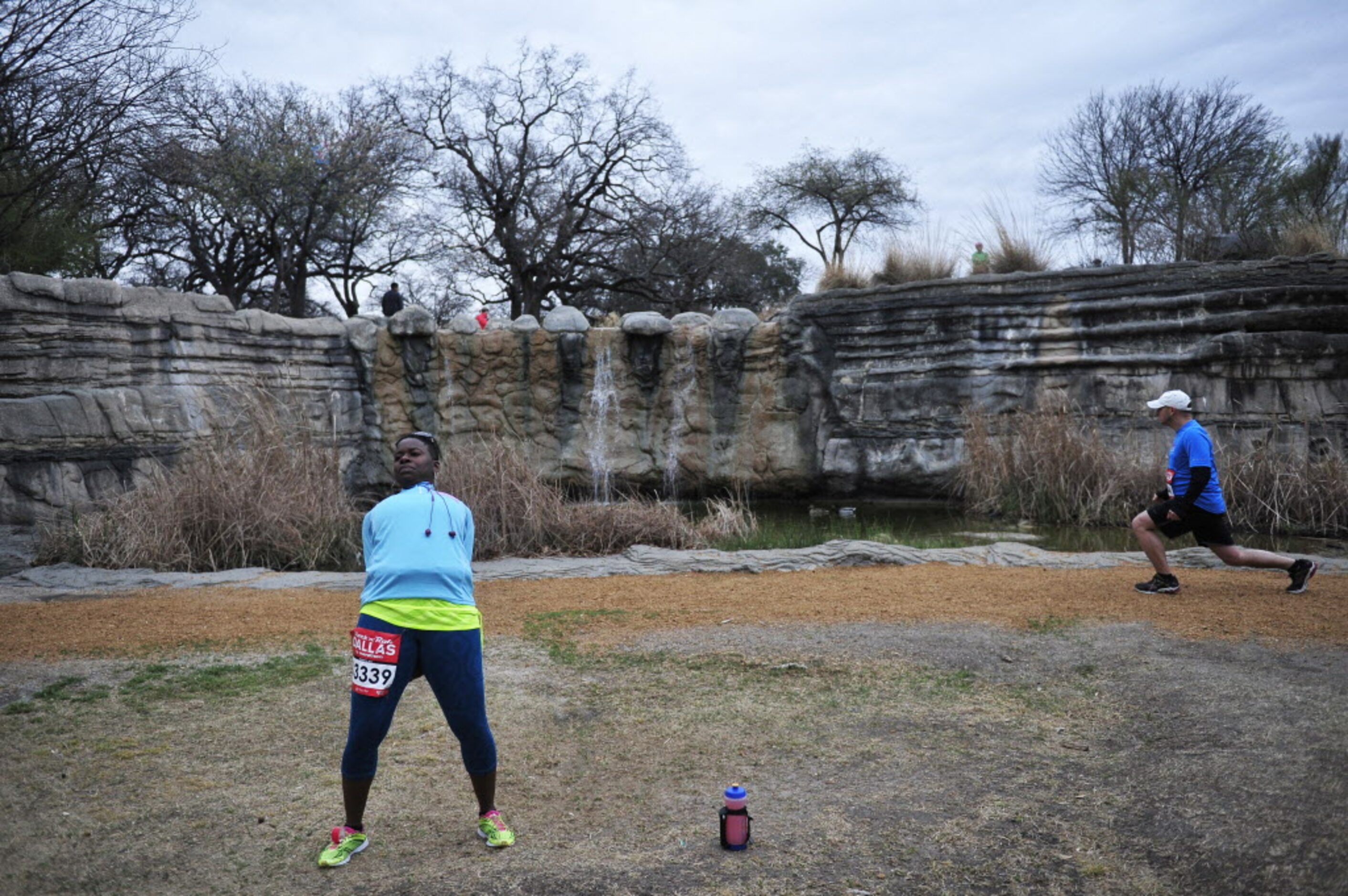 Runners stretch prior to the start of the Dallas Rock N' Roll half-marathon on Sunday, March...