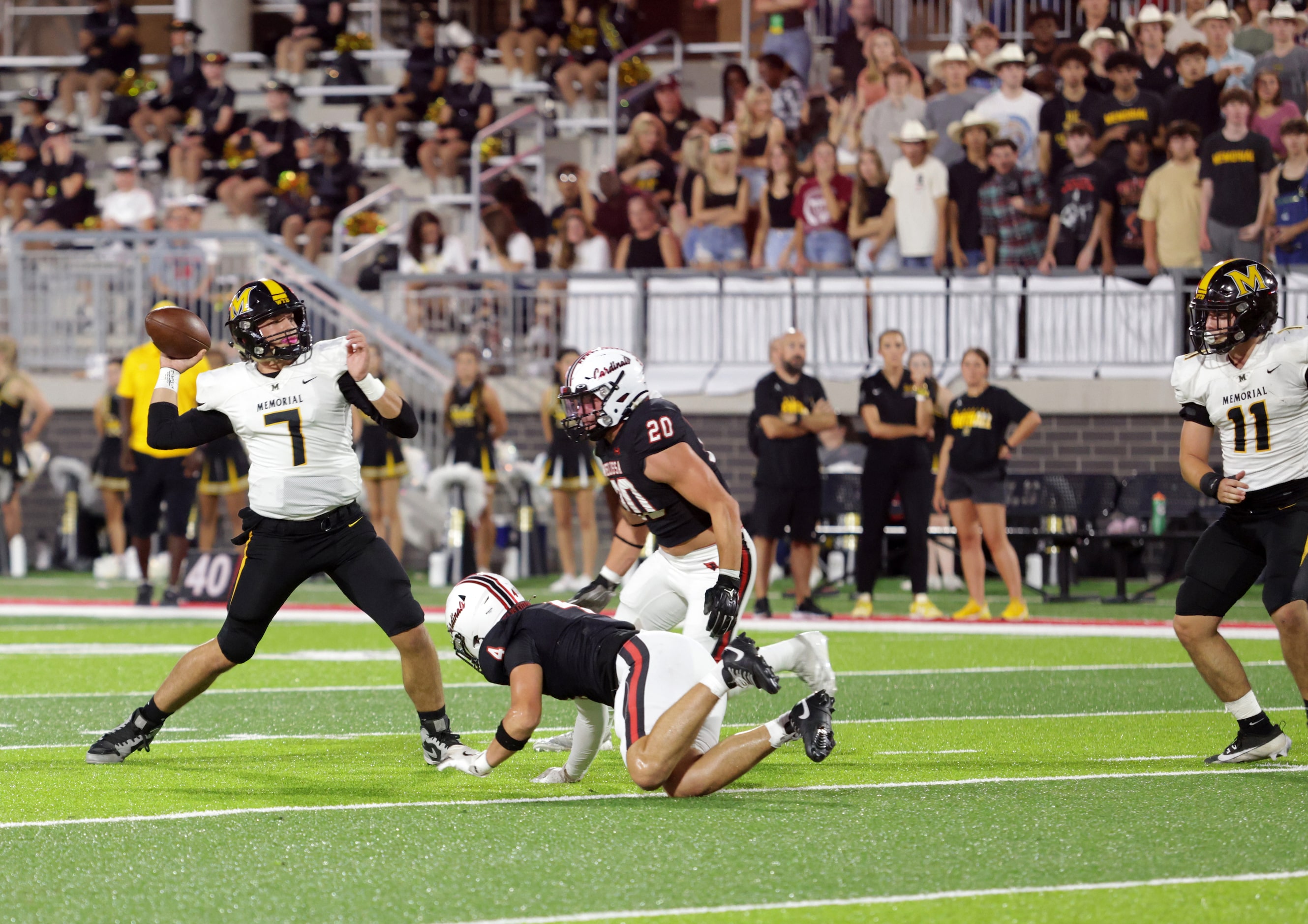 Memorial player #7 Benjamin Wilson prepares to pass as Melissa players #4 Max Corbin and #20...