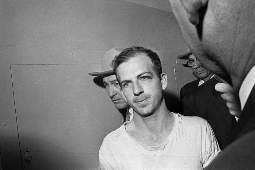 In this Nov. 23, 1963 file photo, Lee Harvey Oswald is led down a corridor of the Dallas...