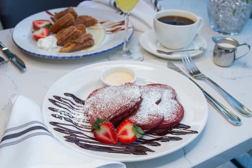 Overeasy offers heart-shaped red velvet pancakes with warm cream cheese creme anglaise,...