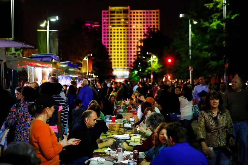 Food trucks and picnic tables line the middle of Flora Street during Aurora 2013.